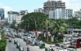 Vehicles wait in a queue to refuel with compressed natural gas (CNG) at a filling station in Dhaka on July 26, 2026. (Photo by MUNIR UZ ZAMAN / AFP)
