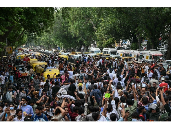 Cockroach Janta Party (CJP) supporters celebrate the resignation of India's Education Minister Dharmendra Pradhan, at Jantar Mantar in New Delhi on July 25, 2026.  (Photo by Sajjad HUSSAIN / AFP)