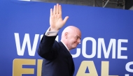 FIFA President Gianni Infantino waves as he arrives for the 2026 World Cup football tournament final match in East Rutherford on July 19, 2026. (Photo by Charly Triballeau / AFP)
