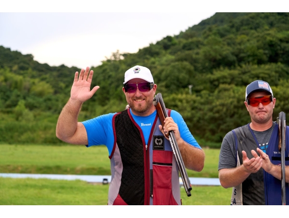 Qatar's Angelo Scalzone (left) celebrates after winning the silver medal.
