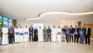 UDST President Dr. Salem Al-Naemi, officials and graduates during the ceremony.