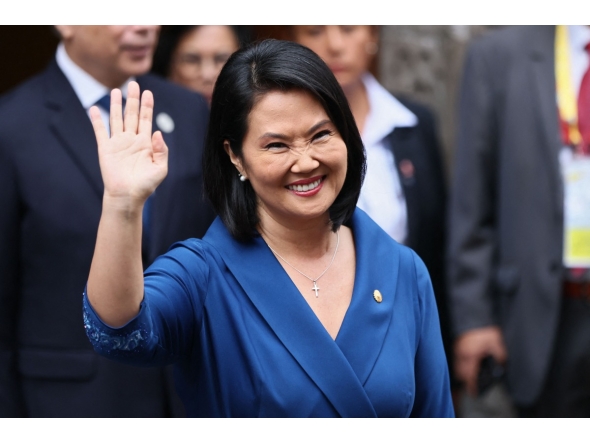 Peru's president-elect Keiko Fujimori waves as she leaves the Foreign Affairs Ministry building for the Congress building after bilateral meetings with heads of state in Lima, on July 28, 2026, ahead of her inauguration. (Photo by Connie FRANCE / AFP)

