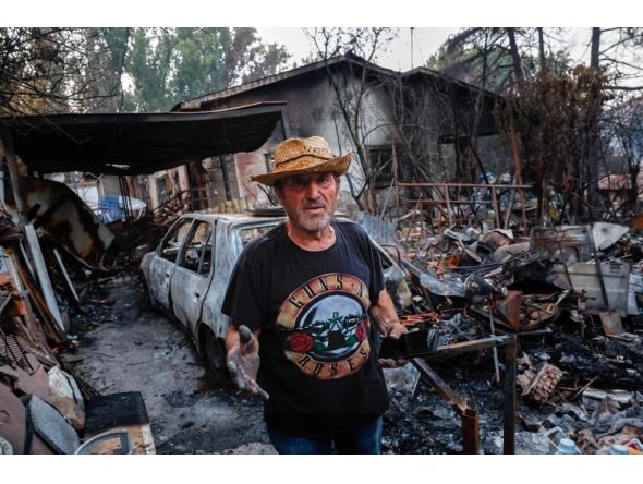 Jose Fernandez is pictured at his burnt-out home following a devastating wildfire in Pelayos de la Presa, 65 kilometers west of Madrid, on July 28, 2026. (Photo by Pierre-Philippe Marcou / AFP)