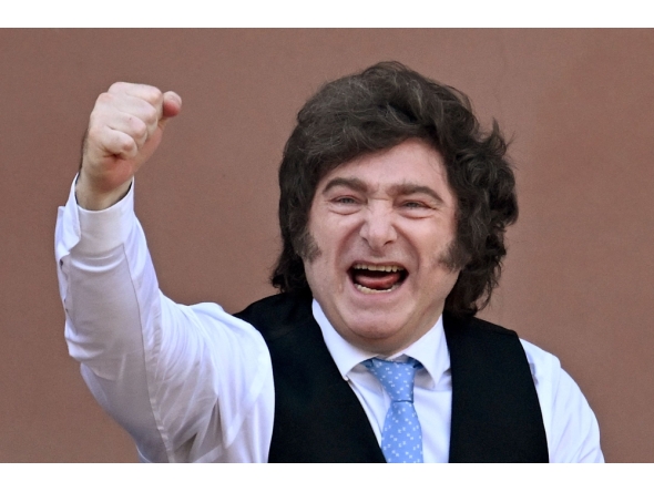(FILES) Argentina's President Javier Milei gestures from the balcony of Casa Rosada presidential palace after a Te Deum marking the 216th anniversary of the May Revolution that led to Argentina's independence from Spain, in Buenos Aires on May 25, 2026. (Photo by Luis ROBAYO / AFP)
