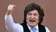 (FILES) Argentina's President Javier Milei gestures from the balcony of Casa Rosada presidential palace after a Te Deum marking the 216th anniversary of the May Revolution that led to Argentina's independence from Spain, in Buenos Aires on May 25, 2026. (Photo by Luis ROBAYO / AFP)