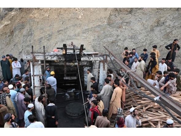Coal miners and relatives gather at the entrance of a coal mine after it collapsed in the Surange area, some 50 kilometres east of Quetta, on July 30, 2026. (Photo by Banaras Khan / AFP)