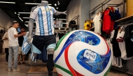 (Files) A replica of the Adidas Trionda, the 2026 FIFA World Cup official football ball, is displayed at a sports shop on June 14, 2026. (Photo by Hazem Bader / AFP)