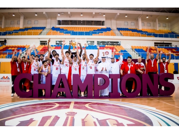 Bahrain players celebrate with their trophy and medals.