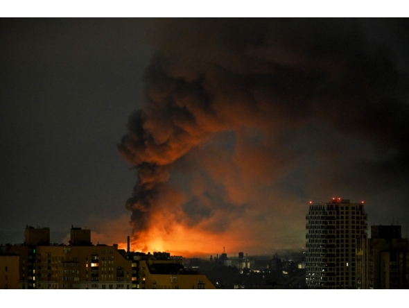Smoke rises above residential buildings following an air attack in Kyiv on August 1, 2026. (Photo by Eugene Kotenko / AFP)
 