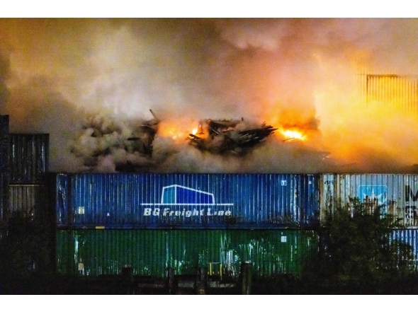 This photograph shows a fire in construction waste at a recycling company near the port of Rotterdam, in Rotterdam on August 7, 2026. (Photo by Jeffrey Groeneweg / ANP / AFP)
 