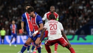 PSG's Spanish forward #09 Ferran Torres (L) and Monaco's Portuguese defender #20 Nazinho during the French L1 football match between Paris Saint-Germain (PSG) and AS Monaco at the Parc des Princes stadium in Paris on September 4, 2026. (Photo by Anne-Christine POUJOULAT / AFP)