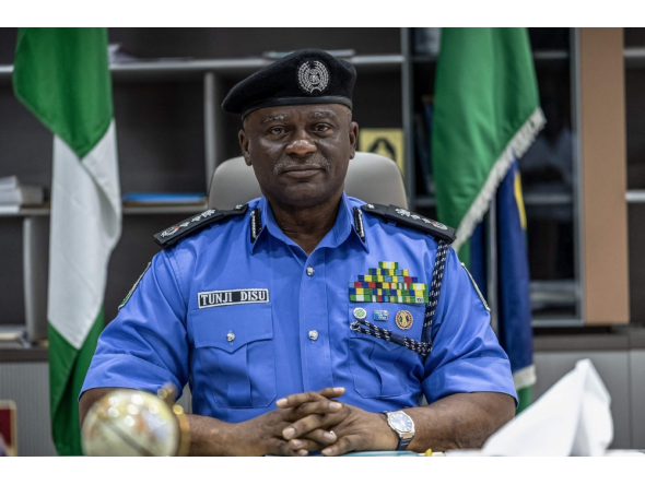 Nigeria's Inspector-General of Police Olatunji Disu poses for a portrait inside his office at the Nigeria Police Force Headquarters, Louis Edet House, in Abuja, on September 9, 2026.  (Photo by Light Oriye Tamunotonye / AFP)