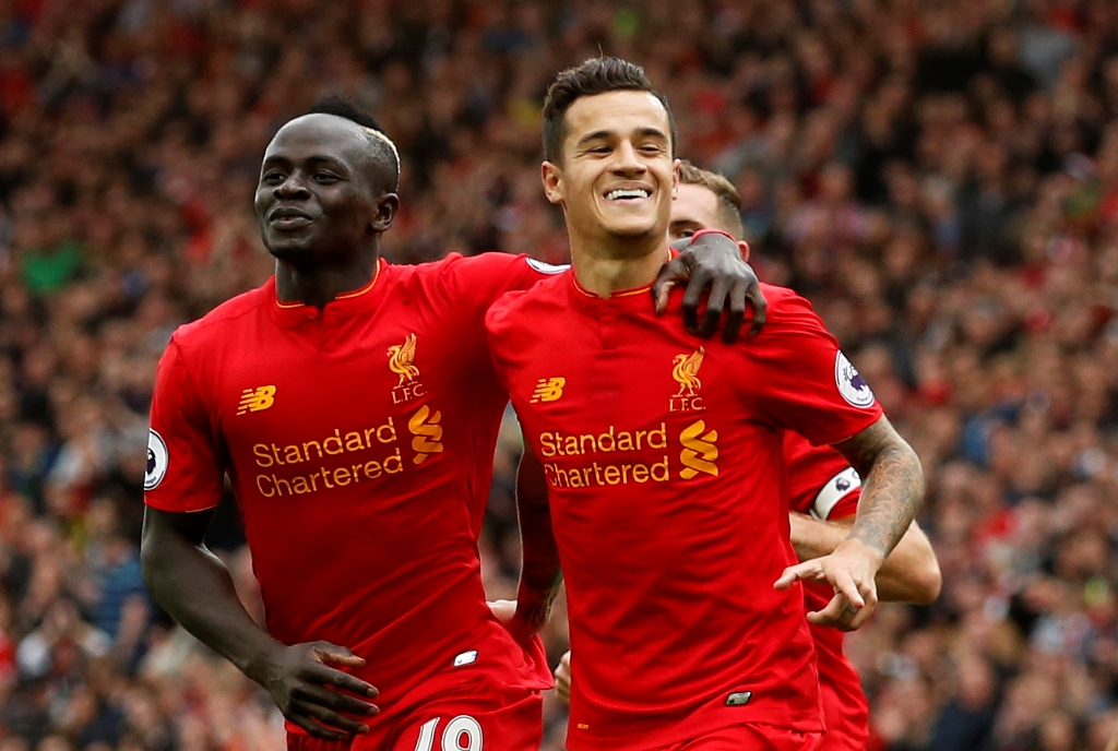 Liverpool's Philippe Coutinho celebrates scoring their fourth goal with Sadio Mane. Reuters / Andrew Boyers