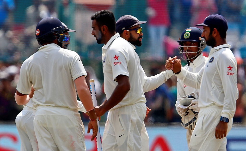 India's cricket players celebrate after winning the match. (REUTERS/Danish Siddiqui)