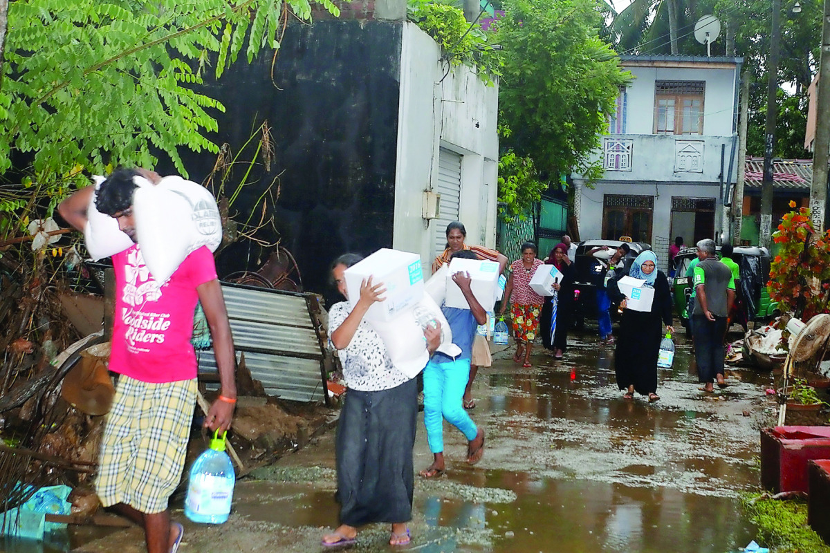 Flood victims collecting aid from RAF volunteers in Sri Lanka.