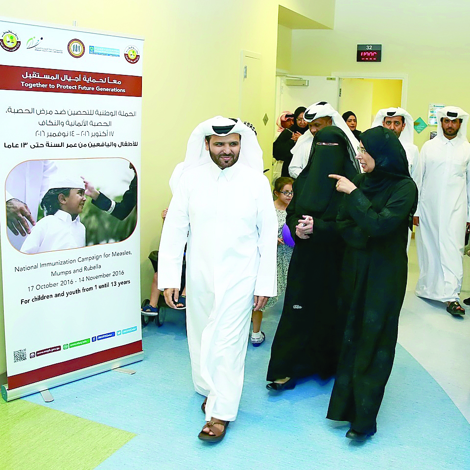 Minister of Public Health H E Dr Hanan Mohamed Al Kuwari with PHCC and HMC officials after inaugurating the immunisation drive yesterday. 