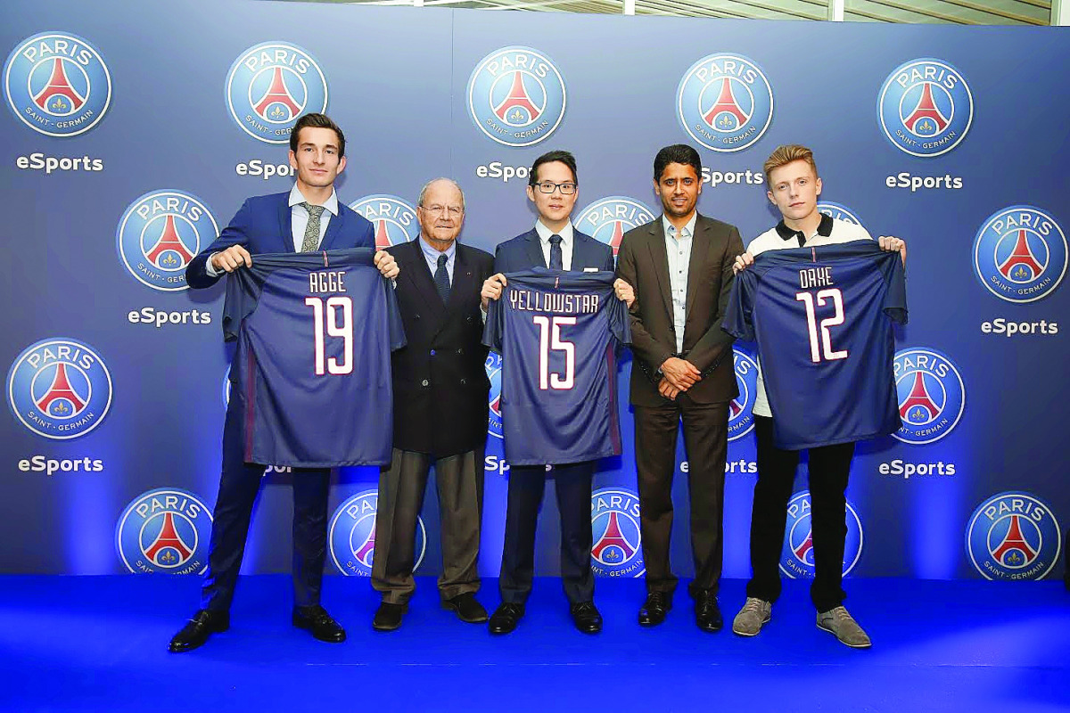 Paris Saint-Germain President Nasser Al Khelaifi (second right) and Marc Ladreit de Lacharrière, the CEO of Fimalac (second left) pose for a photograph with their newest signings, France’s Bora Kim, Lucas Cuillerier and Denmark’s August Rosenmeier during 
