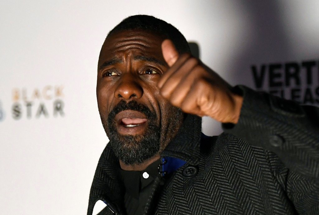 Idris Elba poses as he arrives for the UK premiere of 