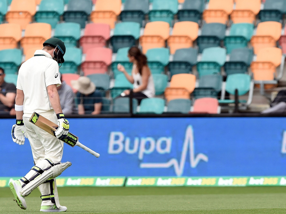 Australia's captain Steven Smith walks off the field with his heads down following his dismissal off South Africa's paceman Kagiso Rabada on the fourth day's play of the second Test cricket match between Australia and South Africa in Hobart on November 15