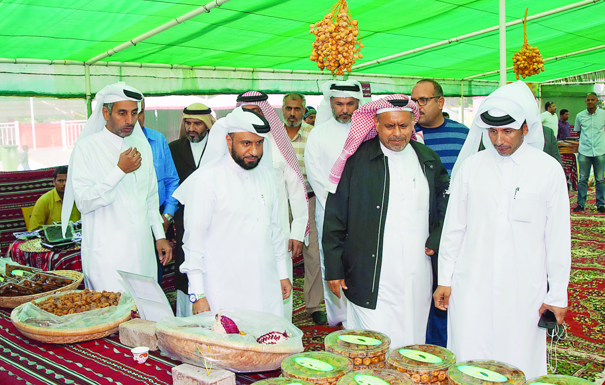 Officials and customers at the dates festival, which was inaugurated at Al Mazroua Yard yesterday.