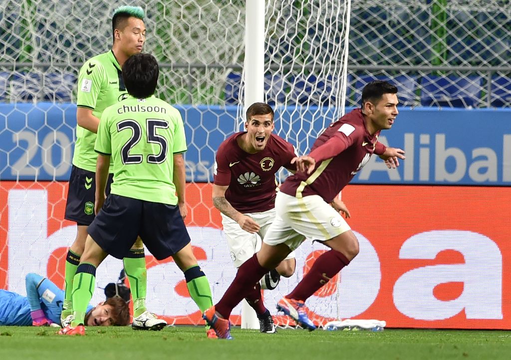 Club America forward Silvio Romero (R, #9) reacts following his goal during the Club World Cup football match between Jeonbuk Hyundai and Club America in Suita, Osaka prefecture on December 11, 2016. / AFP / KAZUHIRO NOGI