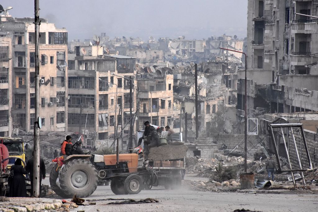 Syrian troops cemented their hold on Aleppo after retaking full control of the city, as residents anxious to return to their homes moved through its ruined streets. AFP / George OURFALIAN