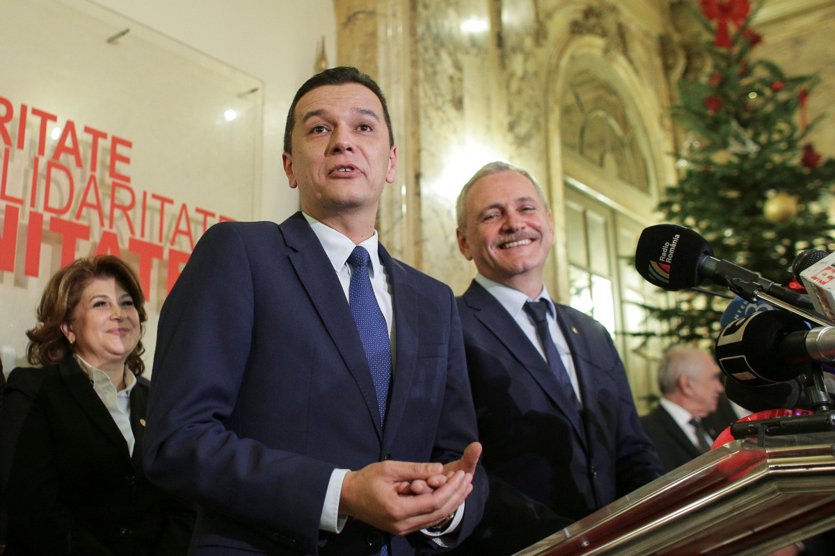 Sorin Grindeanu (C) gestures while answering a question during a press conference held alongside Romania's Social Democrat party (PSD) leader, Liviu Dragnea (R), in Bucharest, Romania December 28, 2016. Inquam Photos/Octav Ganea/via REUTERS 