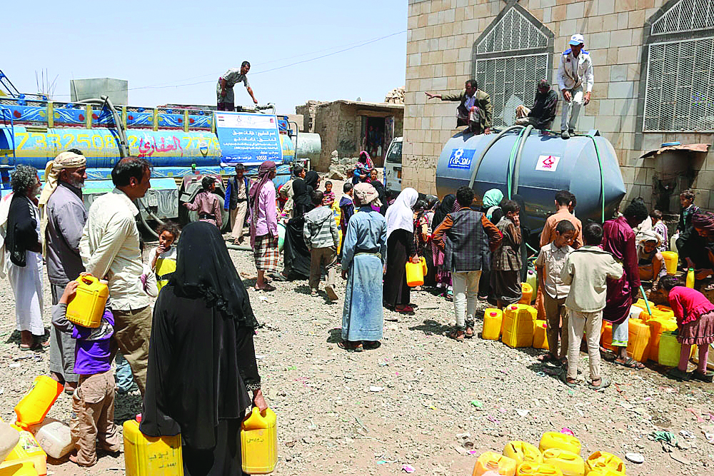 Beneficiaries taking water from a project set-up by RAF in Yemen.