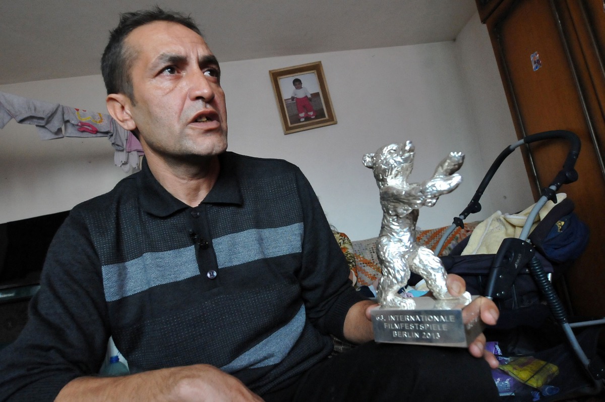 This file photo taken on February 20, 2013 shows Bosnian Roma actor Nazif Mujic (42) holding his Silver Bear prize from 2013 Berlinale, in his home in village of Svatovac. Silver bear award winning Bosnian Roma actor Nazif Mujic stated on January 6, 2017 