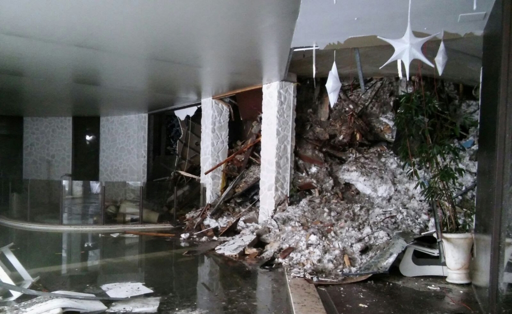 A handout picture released on January 21, 2017 by the Corpo Nazionale Soccorso Alpino e Speleologico (CNSAS) shows a wall of snow engulfing the inside of the Hotel Rigopiano, near the village of Farindola, on the eastern lower slopes of the Gran Sasso mou