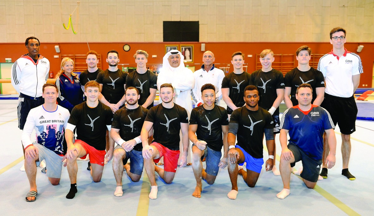 Great Britain's men’s artistic gymnastics team pose for a picture along with their coach Eddie Van Hoof and President of Qatar Gymnastics Federation Ali Al Hitmi in Doha yesterday. Pic by Salim Matramkot/The Peninsula