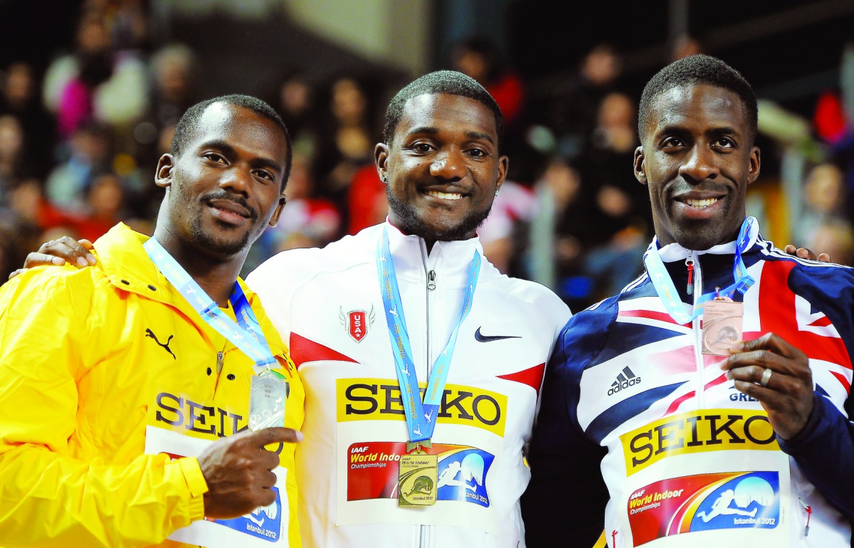 Jamaican sprinter Nesta Carter (extreme left)