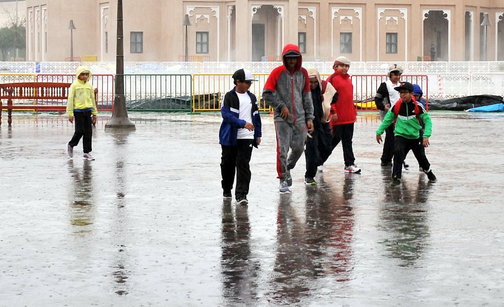 File picture of children enjoying rains at Katara. 