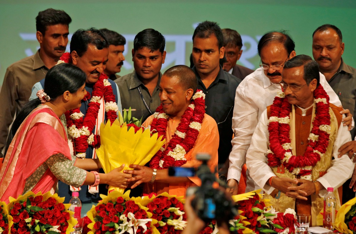India’s ruling Bharatiya Janata Party (BJP) leader Yogi Adityanath (C) is greeted after he was elected as Chief Minister of India’s most populous state of Uttar Pradesh, during the party lawmakers' meeting in Lucknow, India March 18, 2017. (REUTERS/Pawan 