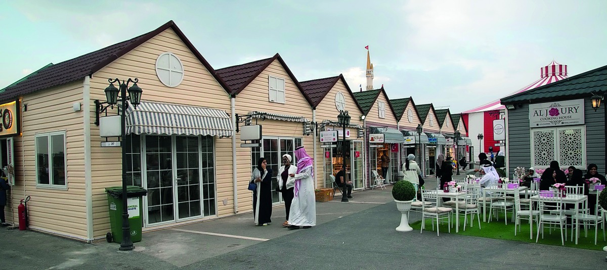Visitors near the outlets at the Magical Festival Village at Katara.
