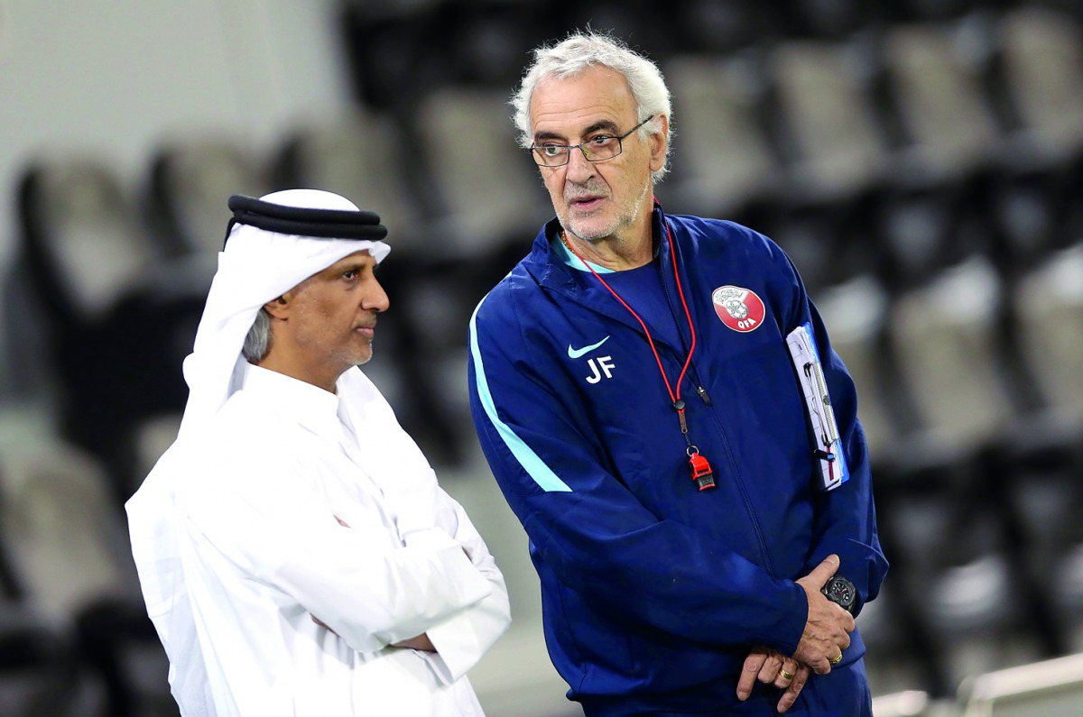 Qatar Football Association (QFA) President Sheikh Hamad bin Khalifa bin Ahmed Al Thani and coach Jorge Fossati talk to each other during yesterday's  training session.