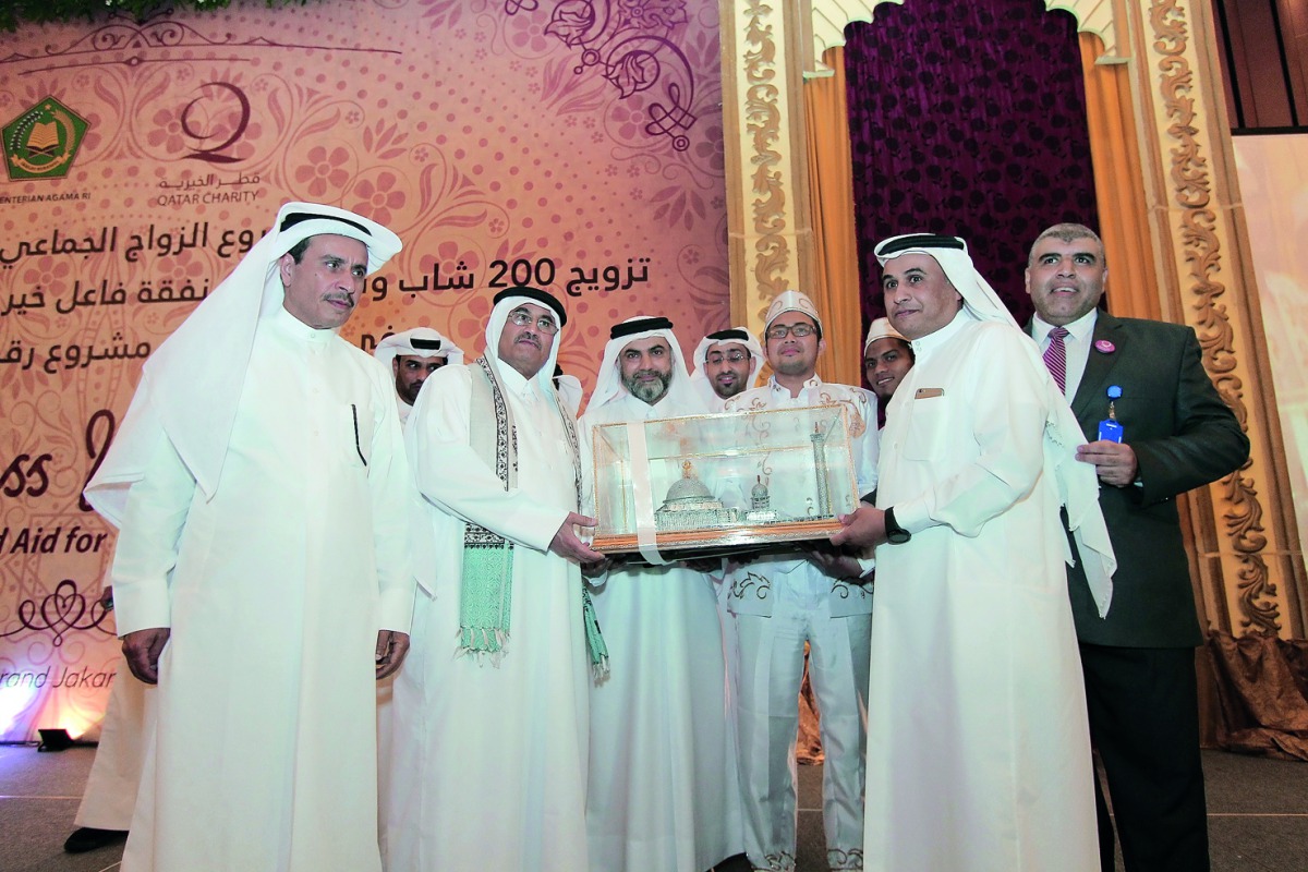 Officials being presented a memento during the ceremony in Jakarta.