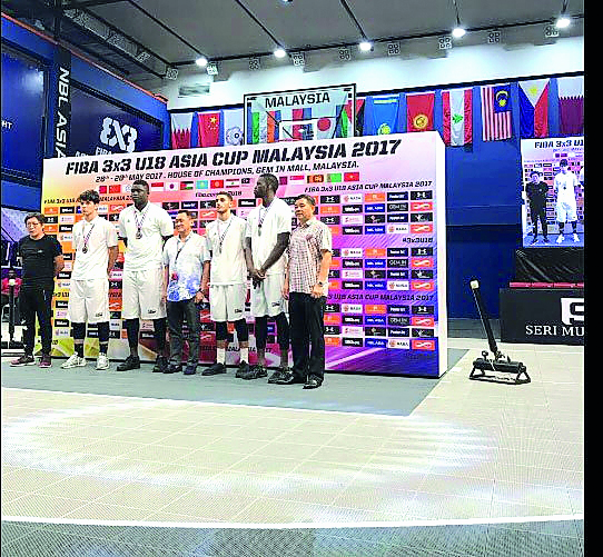 Qatar under-18 basketball players and officials pose for a photograph during the presentation ceremony on Sunday after winning the bronze medal at the 2017 FIBA 3x3 U18 Asia Cup Tournament held in Cyberjaya, Malaysia.