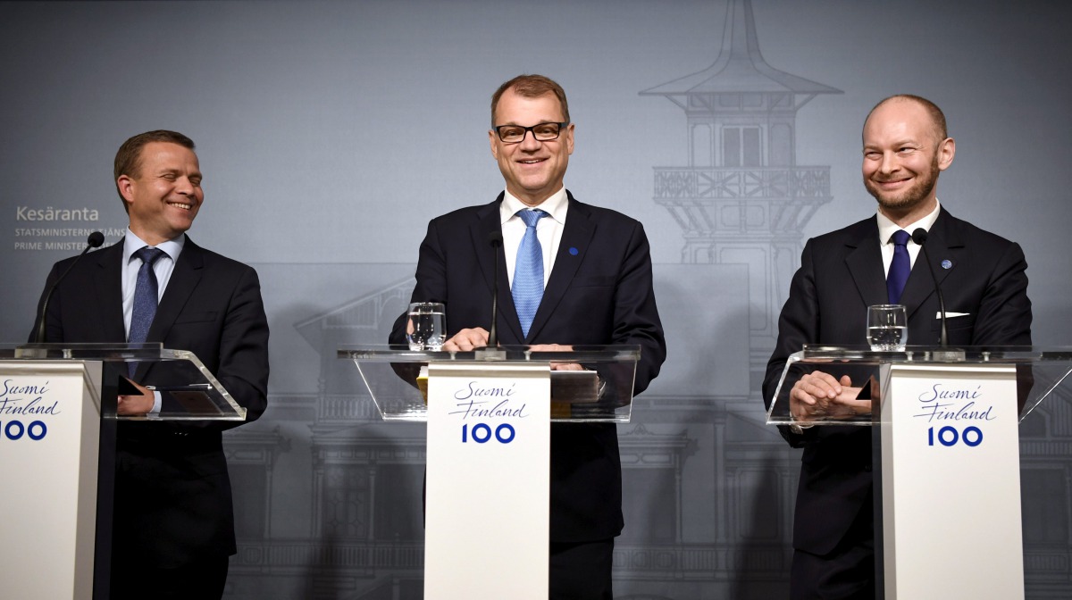 Finnish Minister of Finance National Coalition Party chairman Petteri Orpo (left), Finnish Prime Minister Centre Party chairman Juha Sipilä (centre) and minister Sampo Terho from the New Alternative, attend a press conferance at the PM's official residenc