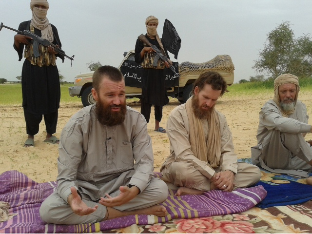 An image grab shows three Western hostages taken captive in northern Mali by the Qaida-linked Al-Din movement, appear in an undiscloed location in Mali: South African-Briton Stephen Malcolm McGown (C), Swede Johan Gustafsson (L) and Dutch national Sjaak R