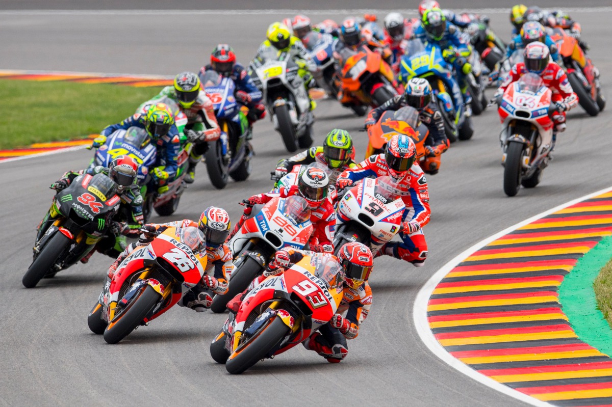Repsol Honda Team's Spanish rider Marc Marquez leads the pack during the MotoGP competition of the Moto Grand Prix of Germany at the Sachsenring Circuit on July 2, 2017 in Hohenstein-Ernstthal, eastern Germany. (AFP / Robert MICHAEL)
