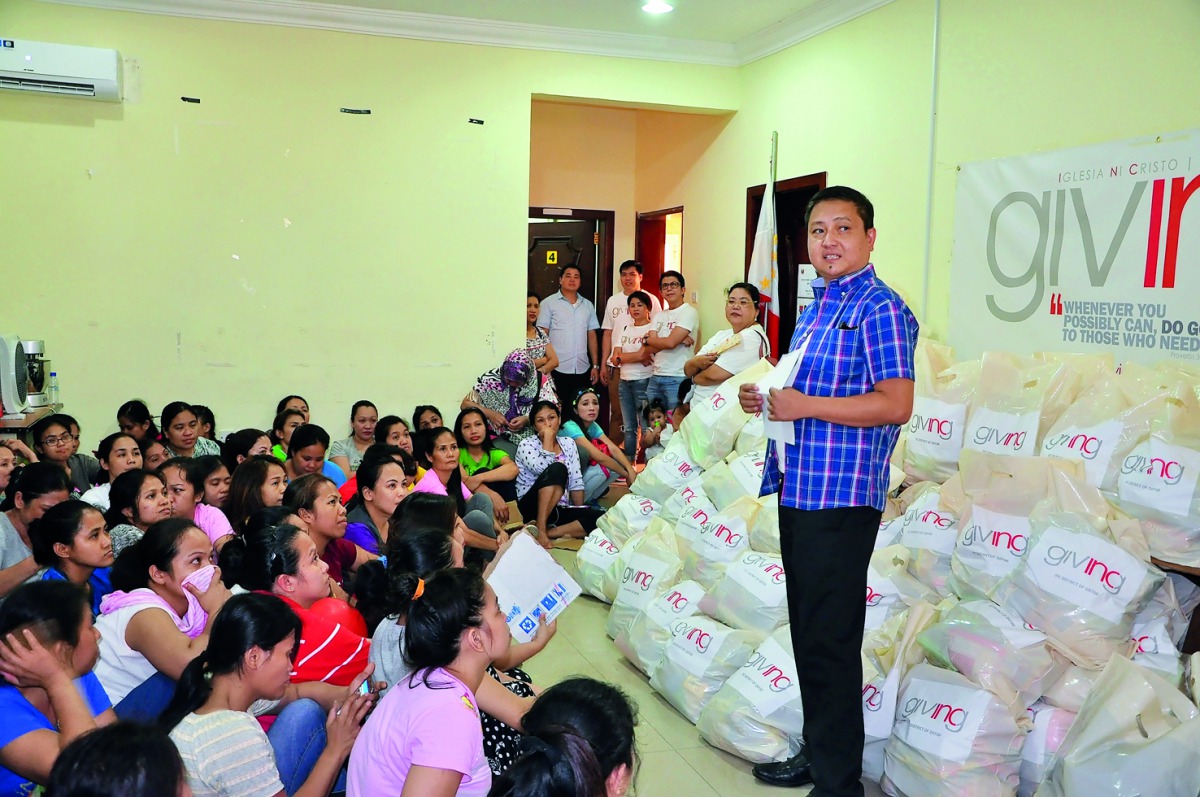 Overseas Filipino Workers waiting to receive kits from INCQ at OWWA office. 