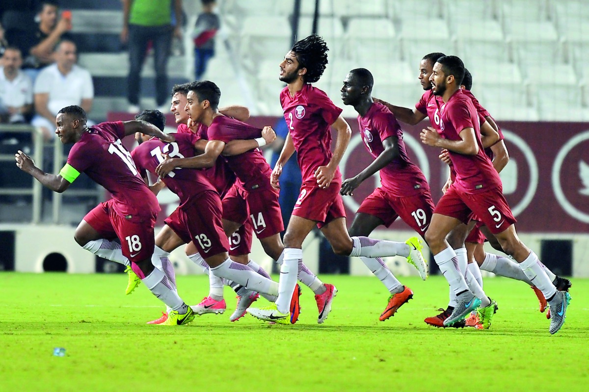 Qatari players celebrate after Sultan Al Barik scored against Syria in their final Group C match of the AFC U-23 Asian Cup Qualifiers at Jassim Bin Hamad Stadium yesterday. Picture by Kammutty VP / The Peninsula