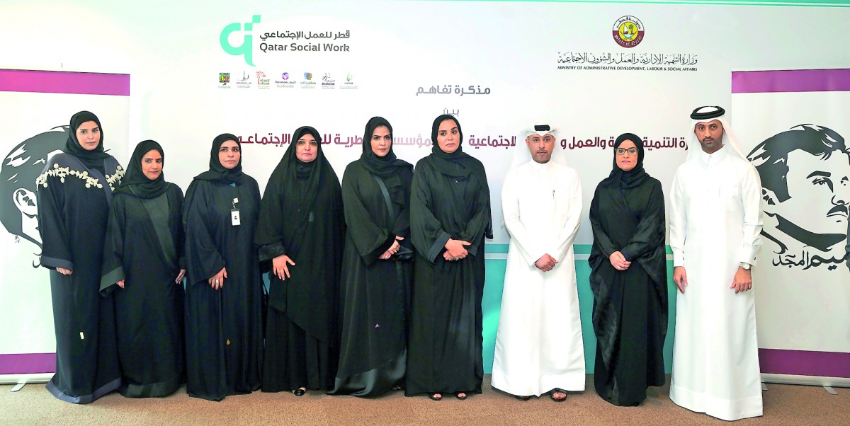 Minister of Administrative Development, Labour and Social Affairs, H E Dr. Issa bin Saad Al Jafali Al Nuaimi, and Chairperson of QFSW, Munira bint Nasser Al Misnad, and other officials at the MoU signing event, yesterday. Pic: Kammutty VP / The Peninsula