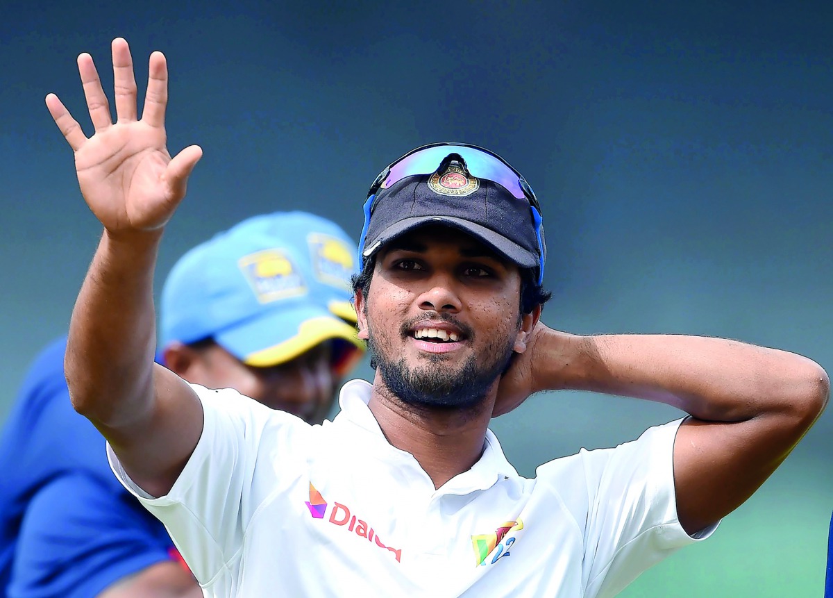 This file photo taken on July 18, 2017 shows Sri Lankan cricket captain Dinesh Chandimal during the one-off Test against  and Zimbabwe in Colombo.