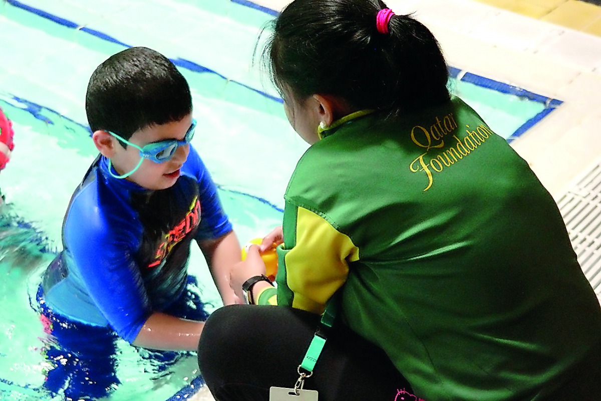A child from QAFA at a swimming class. 