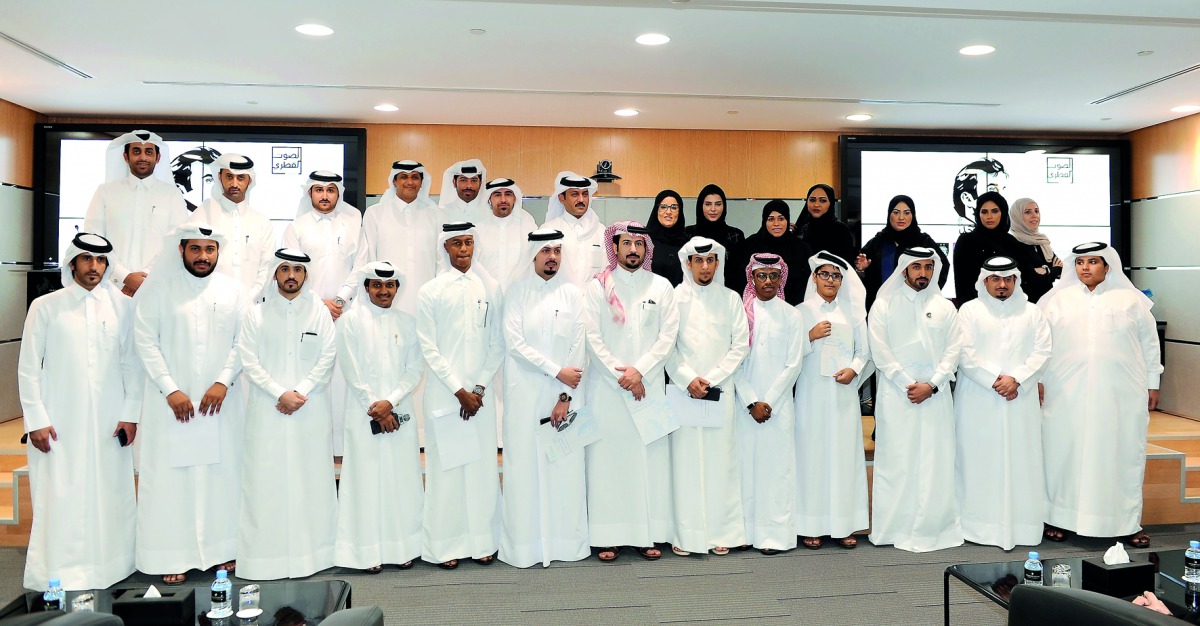 Amaal bint Abdullatif Al Mannai, CEO, Qatar Foundation for Social Work (QFSW), with media persons and volunteers, after the honouring ceremony at the Ali bin Hamad Al Attiyah Arena in Doha yesterday. Pic: Salim Matramkot/ The Peninsula