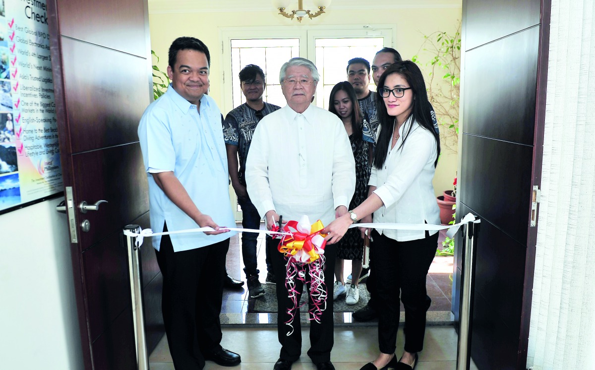 Philippine Ambassador Alan L Timbayan (centre) along with Consul General Roussel R Reyes (left), Vice-Consul Kristine F Bautista (right) and members of Alliance of Filipino Artists in Qatar, cuts a ribbon to formally open the art exhibition yesterday at P