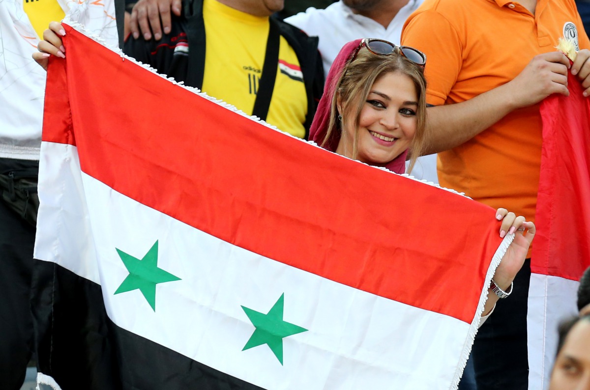 A supporter of Syria's national team attends the FIFA World Cup 2018 qualification football match between Syria and Iran at the Azadi Stadium in Tehran on September 5, 2017.  AFP / Atta Kenare