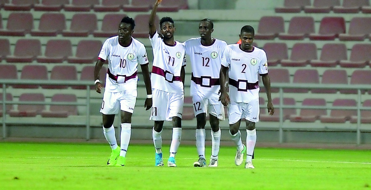Al Markhiya’s  Mohammed Salah (second left) celebrates with team-mates after scoring his second goal against Al Sadd at Al Arabi Stadium yesterday. (Pictures: Kamutty VP/The Peninsula)